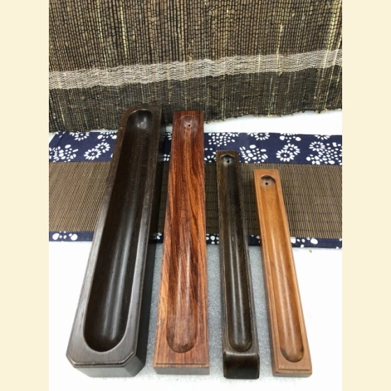 Incense burners made of rosewood and chicken wing wood.