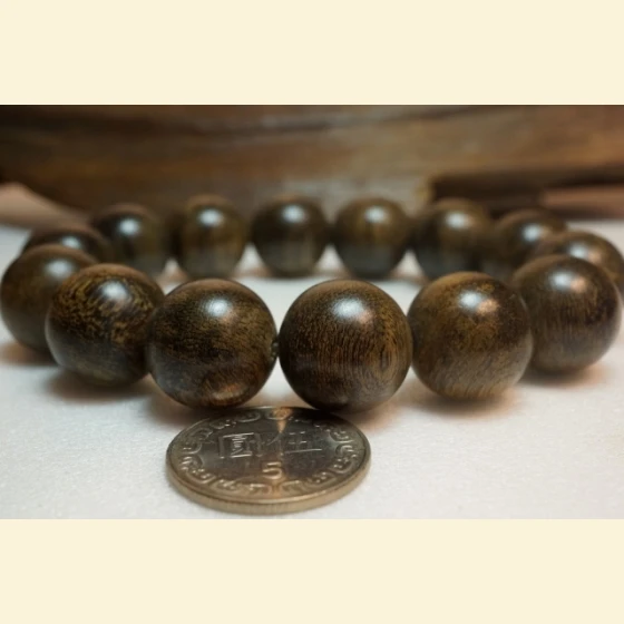 Papuan 16mm mineralized, thousand-year-old, rapidly sinking Buddhist prayer beads~