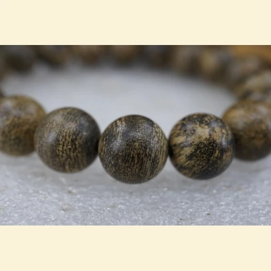 Indonesian Papua semi-submerged agarwood beads, 10mm in diameter, 9.4g.