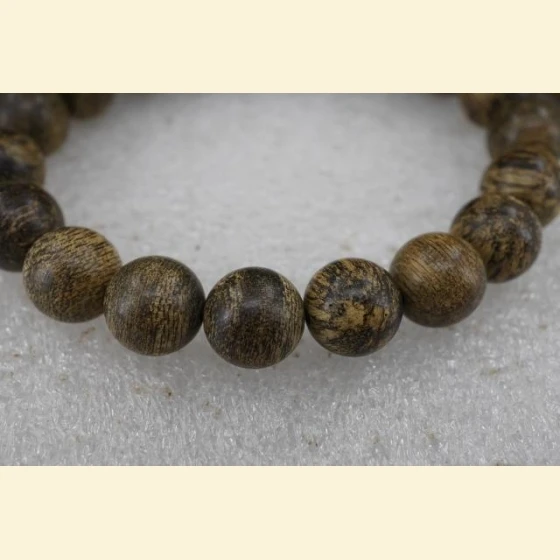 Indonesian Papua semi-submerged agarwood beads, 10mm in diameter, 9.4g.