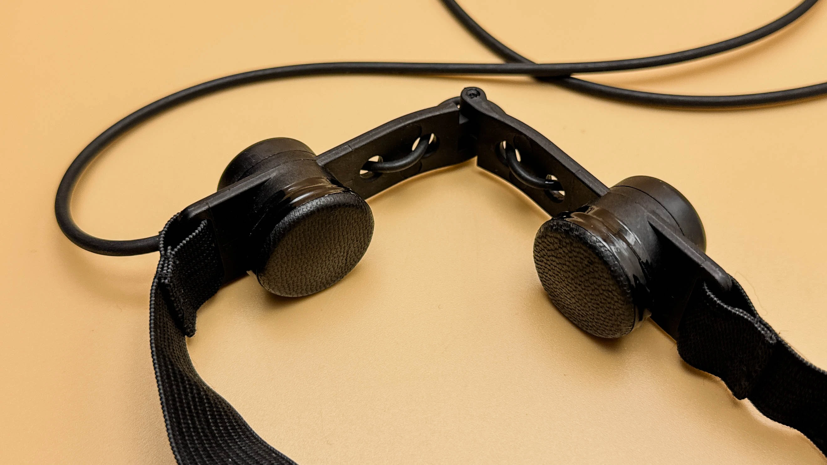 Custom throat microphone module with anti-allergy skin-contact protection for armored vehicle communication
